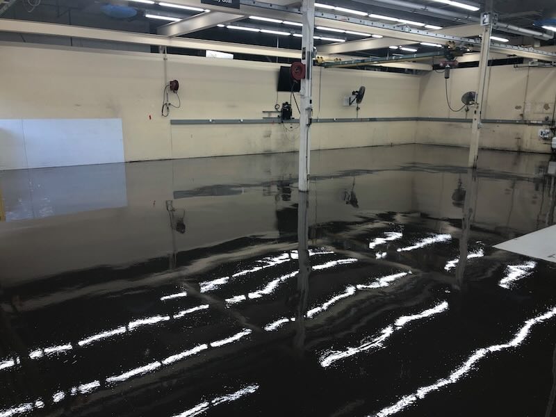 After: Commercial service bay with seamless epoxy flooring